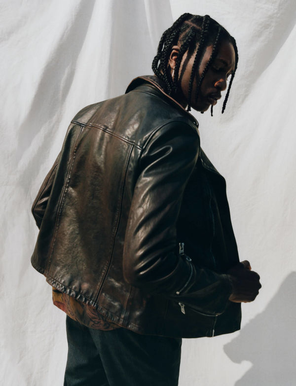 Man wearing Allsaints' leather jacket.