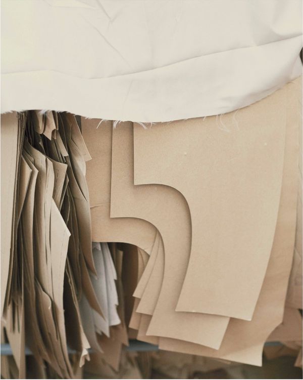 A collection of fit cardboard are hanging in our warehouse.