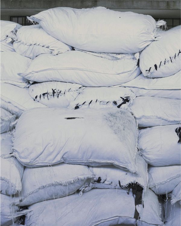 Pile of several sealed bags with leather pieces inside.