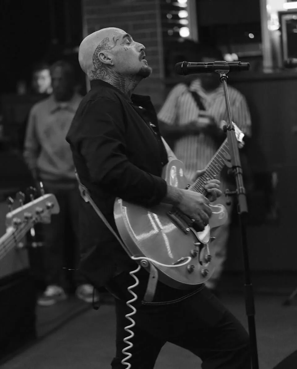 Photo of man with a guitar