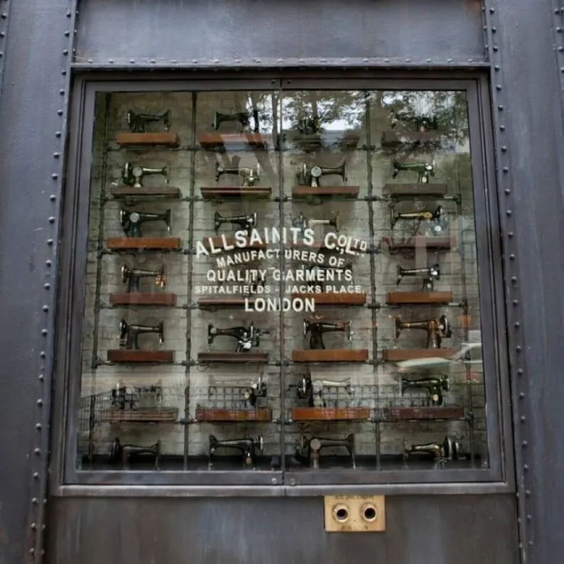 Old Singer sewing machines in the window of a store