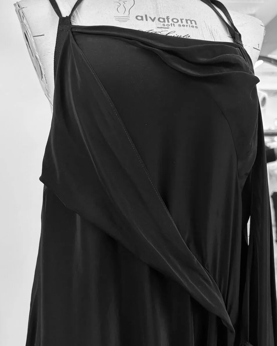 Image of a work in progress black garment on a mannequin